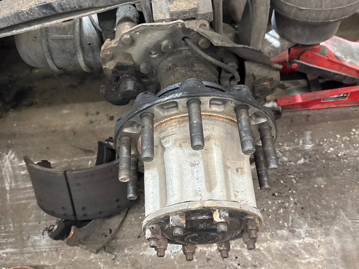 Brake shoes and hub components separated at the axle end
