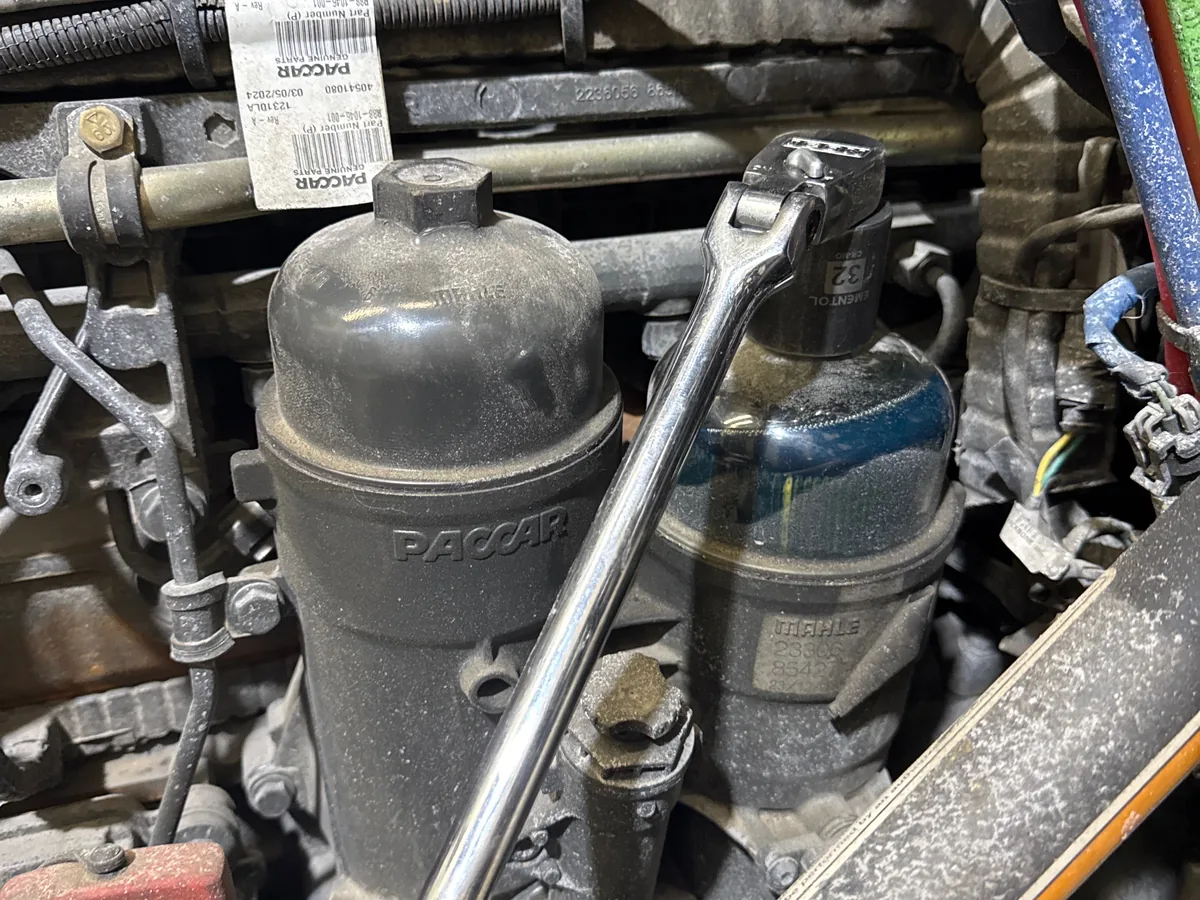 Wrench set on an oil filter housing during a filter change