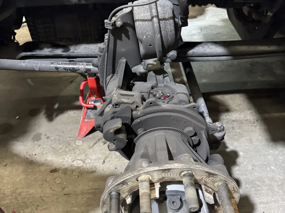 Wheel hub and brake assembly pulled off the end of a semi truck axle